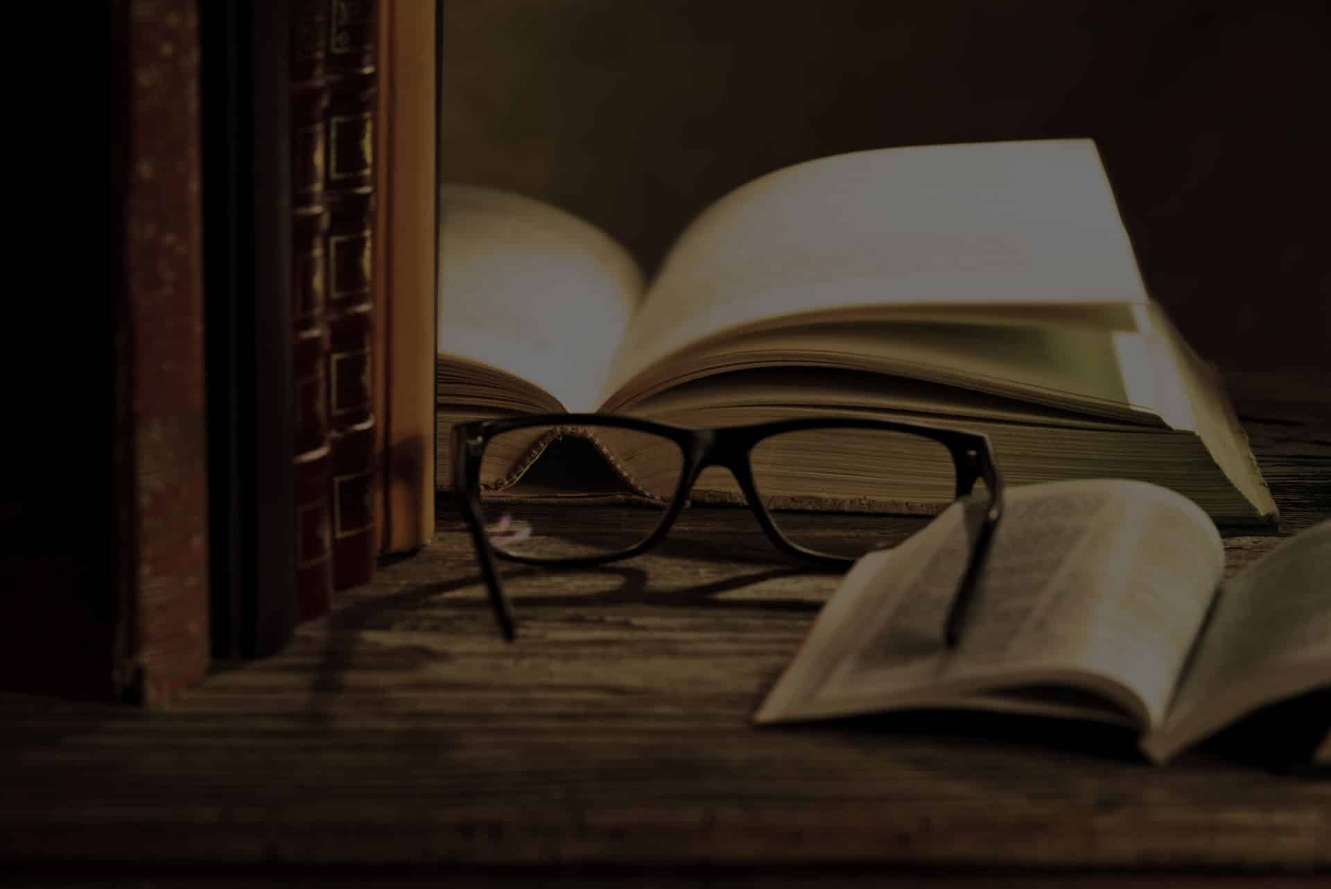 reading glasses with books on the table